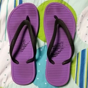 Purple nike flip flops