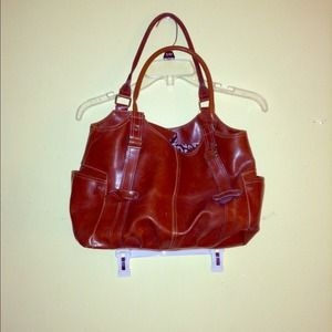 A brown faux leather satchel.