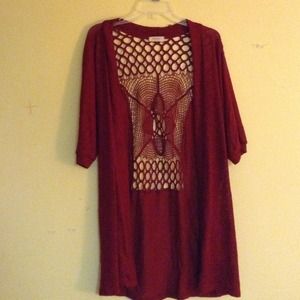 A long red semi open back cardigan