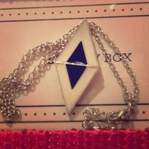 It's black and white and it is in a dimond shape