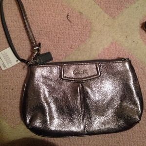SOLD! 🚫🚫 Metallic silver Coach clutch