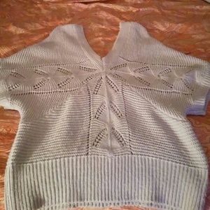 Sexy sweater hangs off your shoulders