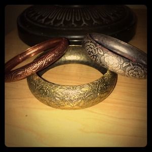 Set of three bangles. Gold/silver/rose tone