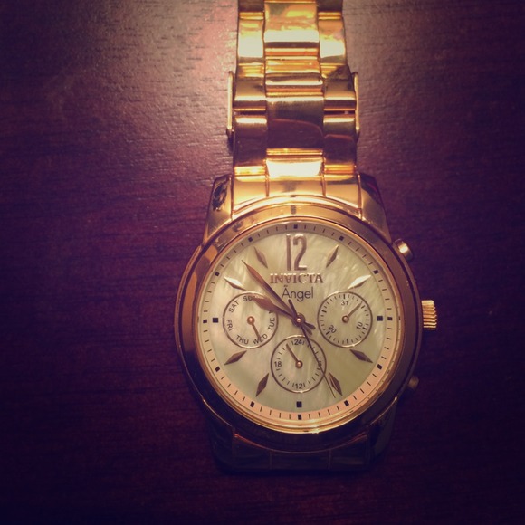 Gold hand watch invicta