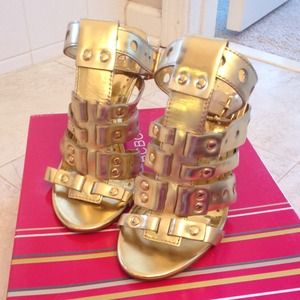 Ankle strap gold sandals.