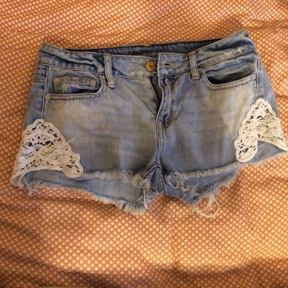 Distressed denim shorts with lace
