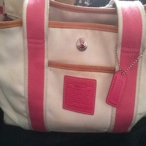 White coach handbag with pink and brown trim