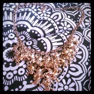 Gold Colored Skull & Crossbones Necklace