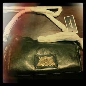 Black Juicy Couture purse never used. Tag still on