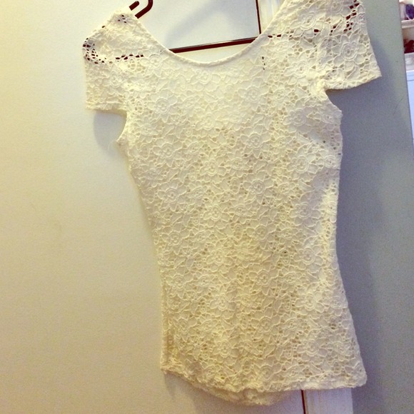 Off white top with beautiful bow on the back.