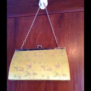 Light green clutch with butterflies
