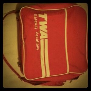 Vintage 1970's TWA carry on tote with strap. Red/w