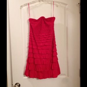 Ruffled red strapless dress.
