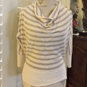 Cream sweater with gold stripes.
