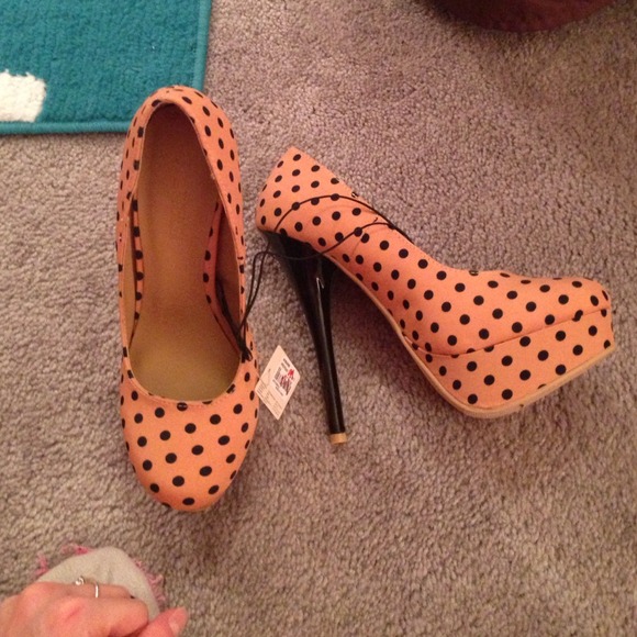 Beige heals with black polka-dots.