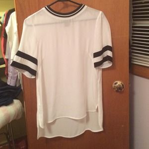 White shirt with black stripes on sleeves