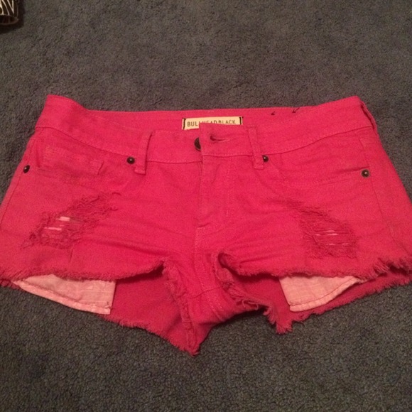Pink distressed shorts