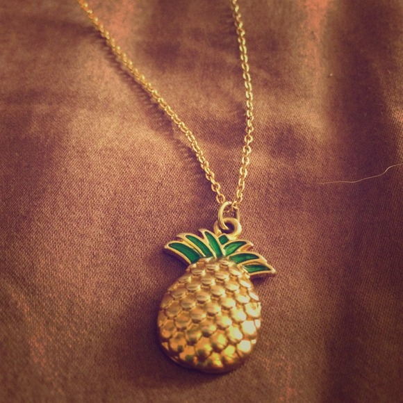 gold pineapple necklace. in good condition