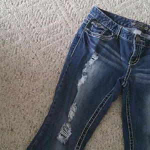Distressed dark wash jeans