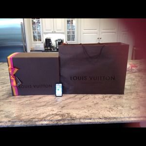 Empty Louis Vuitton gift box with shopping bag.