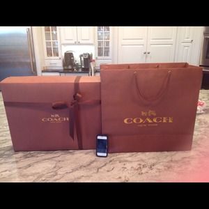 Empty Coach gift box with shopping bag.