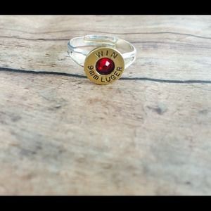 9mm ring W/ red crystal.