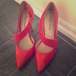 Red patent leather heels by Zigi Soho.