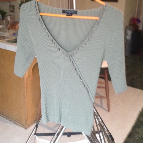 Green v-neck with tassels