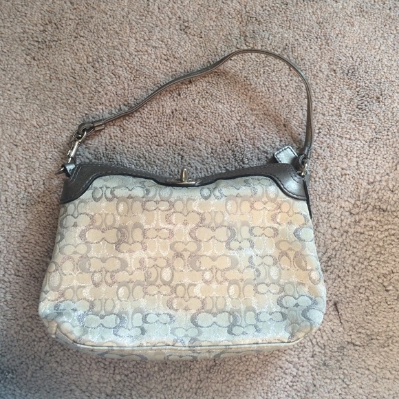 Small silver clutch coach