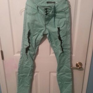 Mint green ripped lovesick super skinny jeans