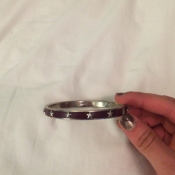 Dark purple Coach bangle with silver stars.