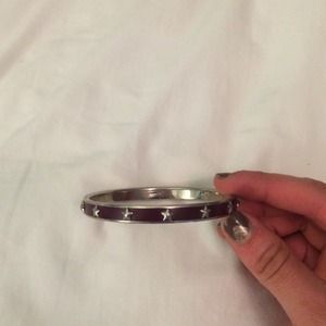 Dark purple Coach bangle with silver stars.