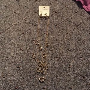 Gold colored earrings and necklace