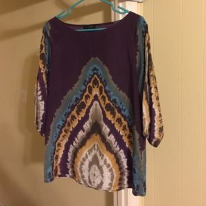 Purple Tie-dye style blouse with open sleeves.