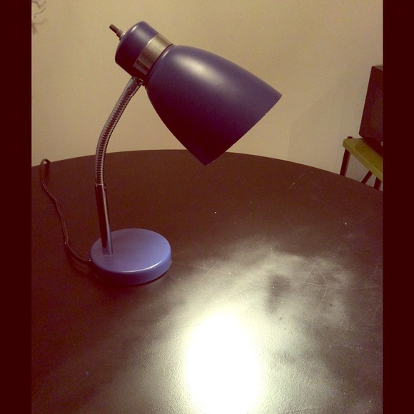 Purple desk lamp used on vanity to paint nails