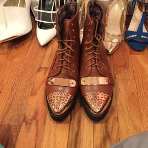 Brown booties with gold embellishments
