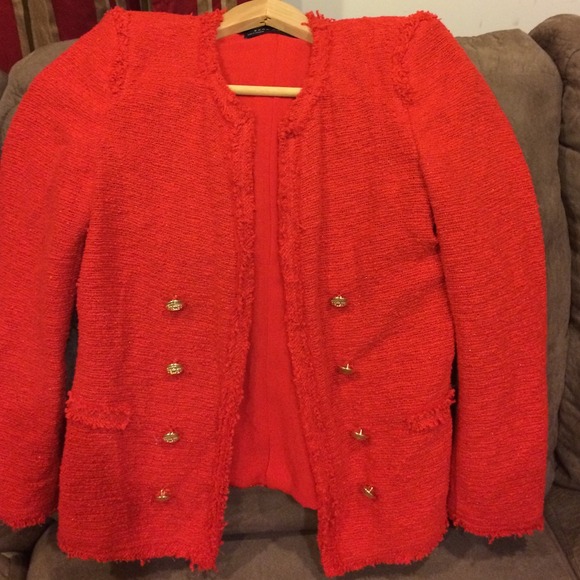 Red blazer no pockets and gold Botton's.