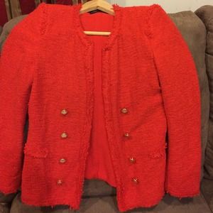 Red blazer no pockets and gold Botton's.
