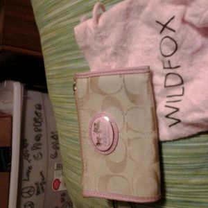 On hold Coach c.c holder with key chain