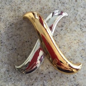 Silver and gold pin