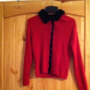 Red sweater with fur around neck
