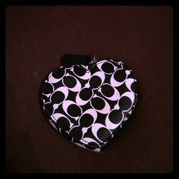 Black and white coach money purse.