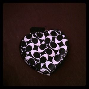 Black and white coach money purse.