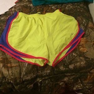 Yellow, pink, and purple nike running shorts