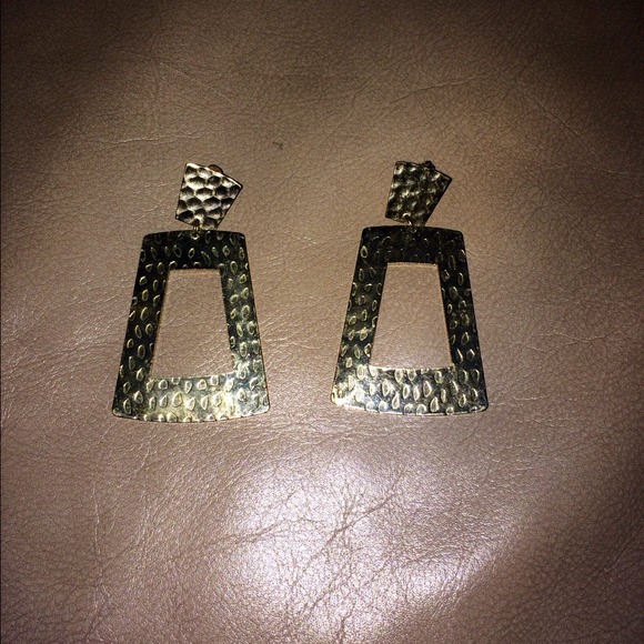 Gold earrings.