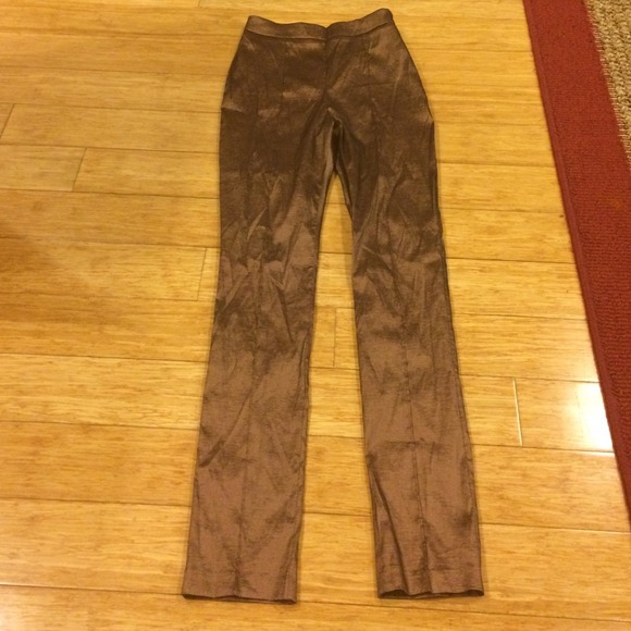 Dark gold, pants high waisted.