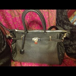Large black studded handbag