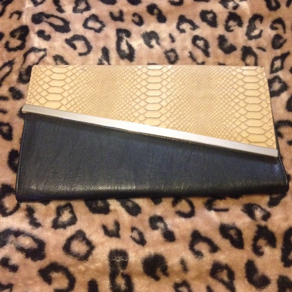 Nude and black clutch