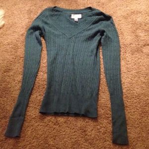 Form fitting sweater