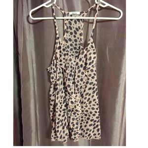 Pastel pink and grey polka-dot top.